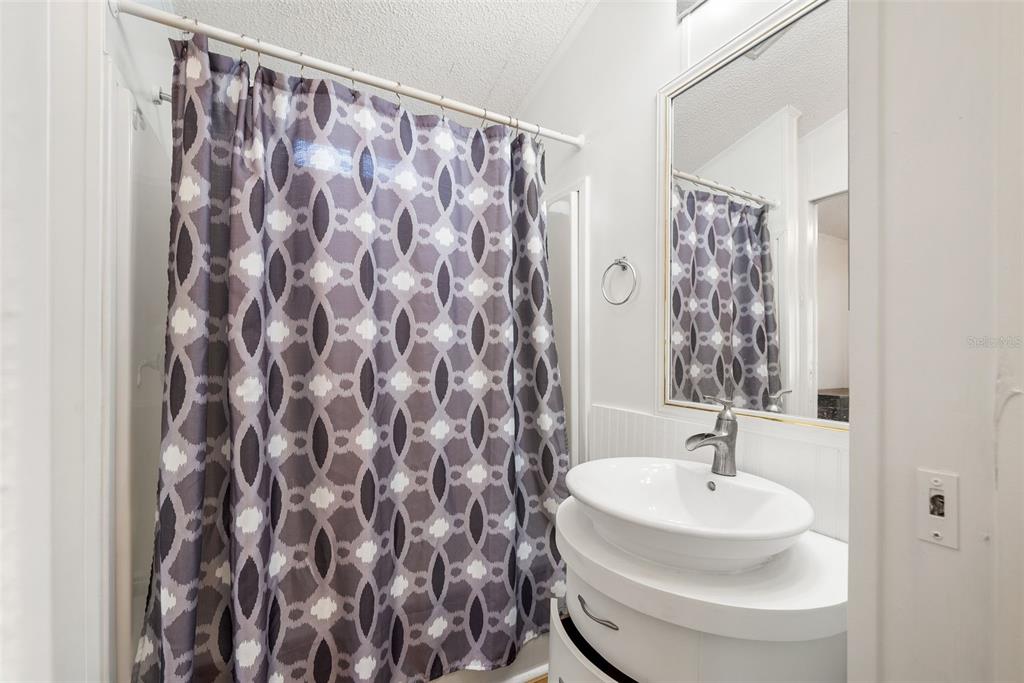 25723 Bareva Road Weeki Wachee, FL 34614 - Photo 44 of 55 a bathroom with a sink and a mirror