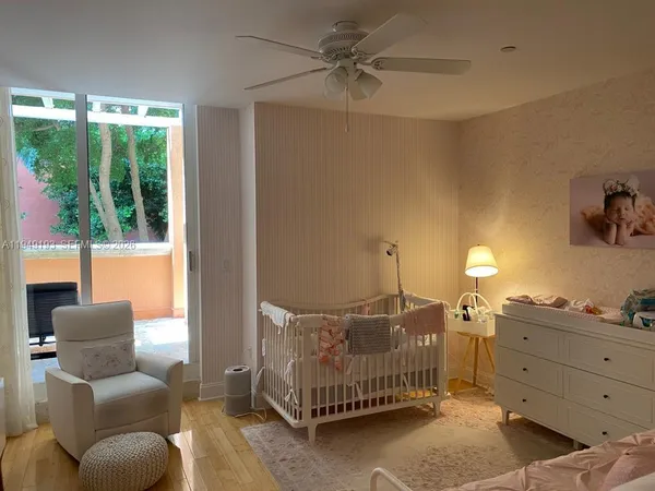 a bedroom with furniture and a window