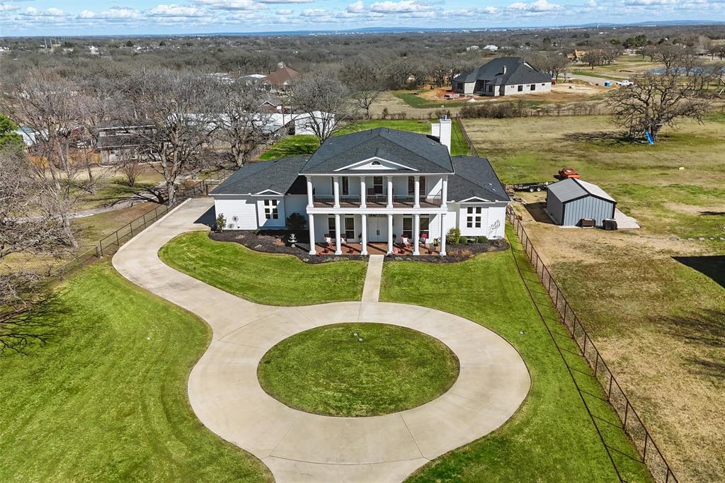 an aerial view of a house with a ocean view