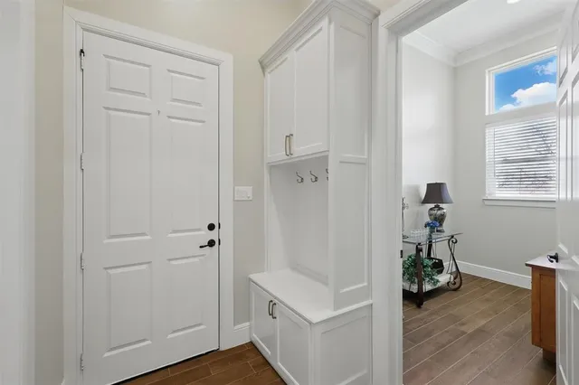a view of hallway with wooden floor