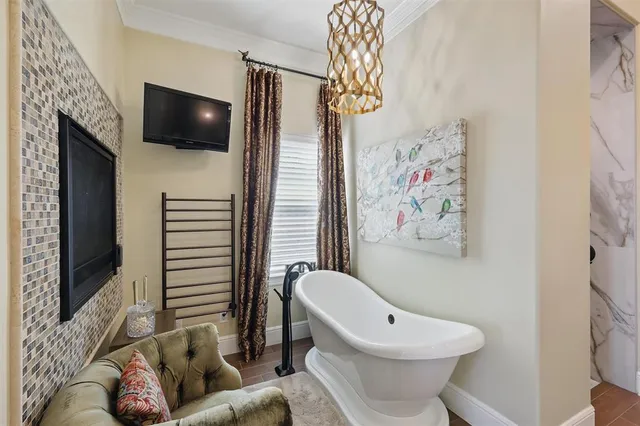 a bathroom with a sink mirror and painting on wall