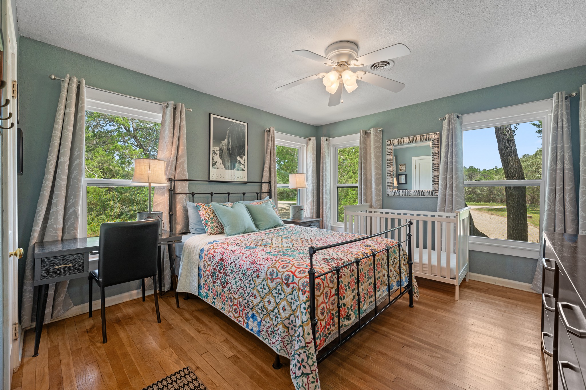 12932 Nutty Brown Road Austin, TX 78737 - Photo 25 of 40 Roadrunner - Comfortable guest bedroom with peaceful views of the surrounding property.