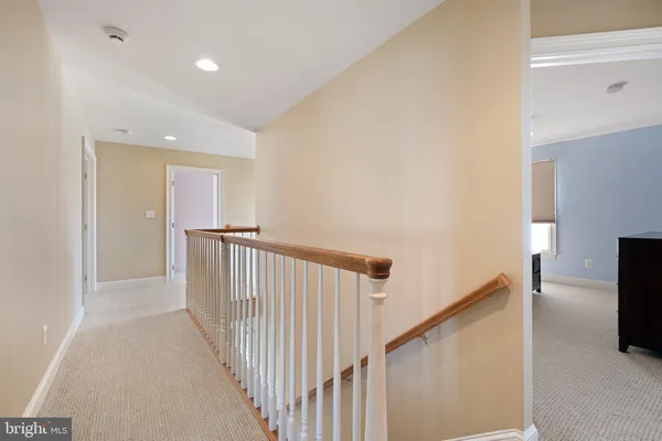 a view of a hallway with stairs