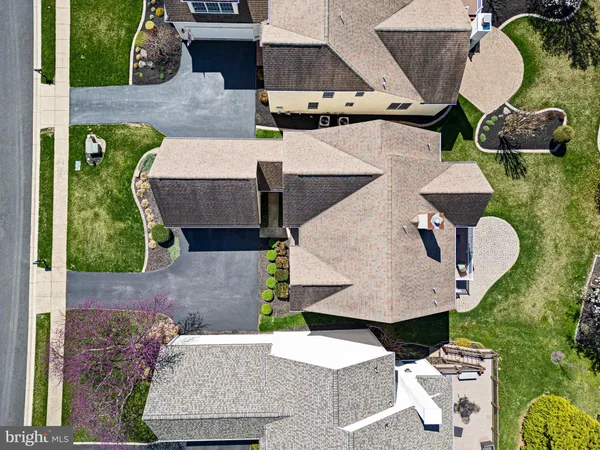 an aerial view of a house with a swimming pool
