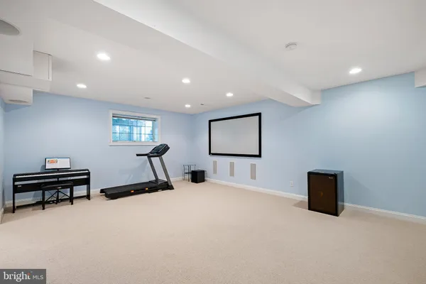 a bedroom with furniture and a mirror