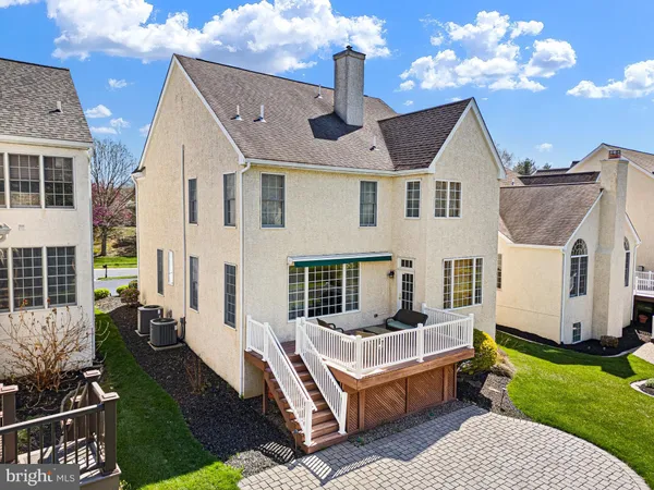 a front view of a house with outdoor seating