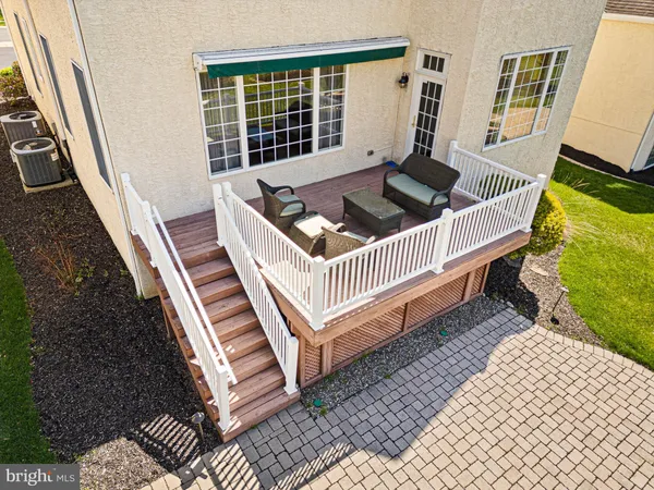 a view of a deck with furniture