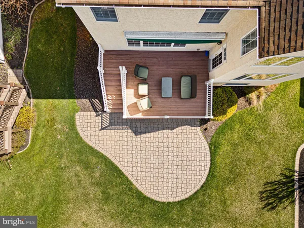 an aerial view of residential house with outdoor space and trees