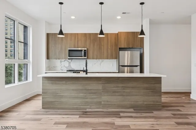 a view of room with wooden floor