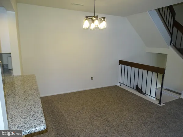 a view of a livingroom with a staircase