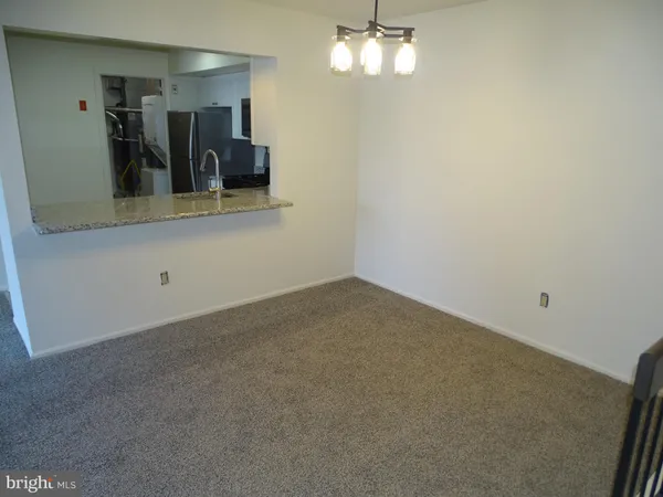 a view of a hallway with workspace