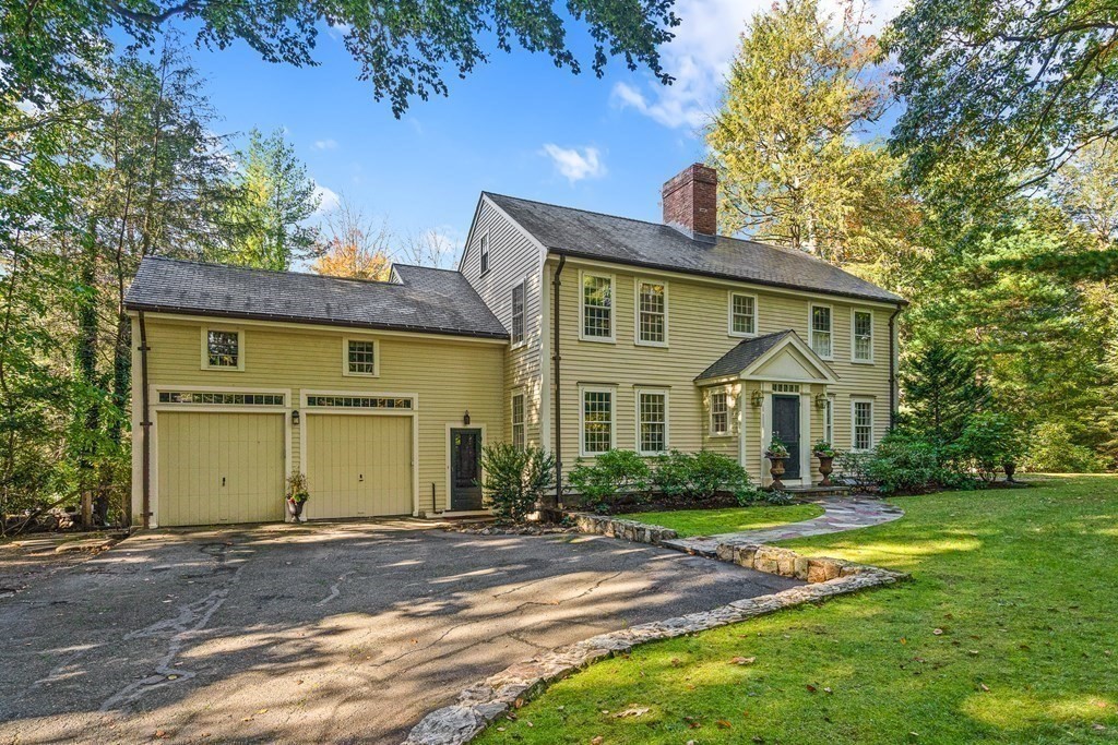 8 Old Farm Road Wellesley, MA 02481 - Photo 1 of 25 a front view of a house with a yard and garage