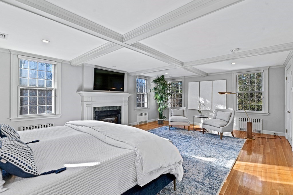 8 Old Farm Road Wellesley, MA 02481 - Photo 14 of 25 a spacious bedroom with a bed and a flat screen tv