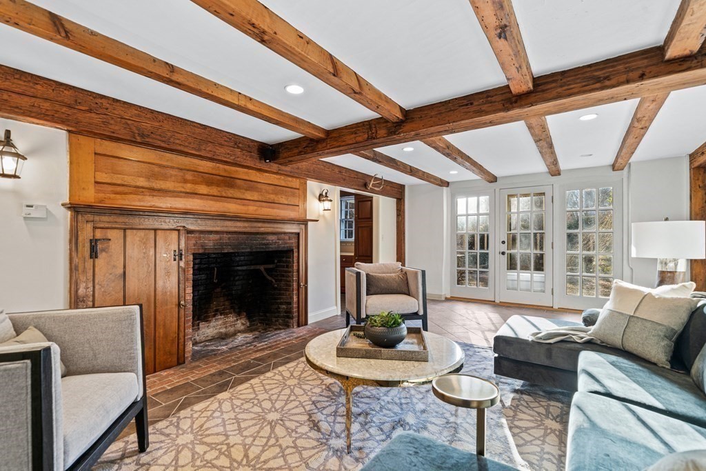 8 Old Farm Road Wellesley, MA 02481 - Photo 20 of 25 a living room with furniture and a fireplace