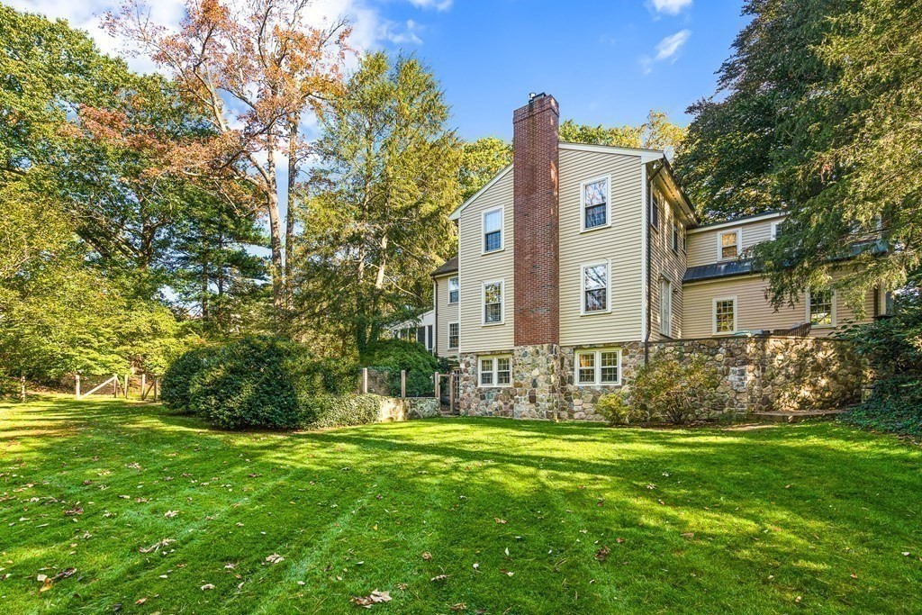8 Old Farm Road Wellesley, MA 02481 - Photo 2 of 25 a front view of a house with garden