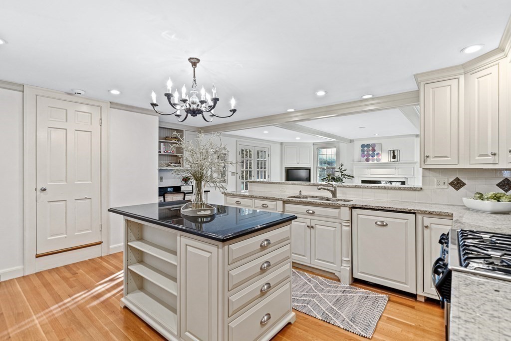 8 Old Farm Road Wellesley, MA 02481 - Photo 5 of 25 a kitchen with a sink stove and cabinets