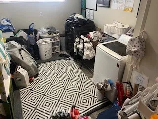 a bed room with a bed and a television