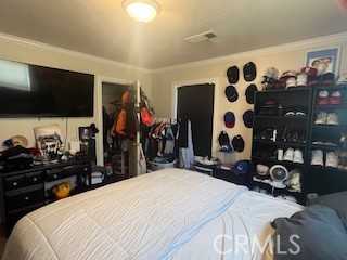 1127 West 23rd Street Merced, CA 95340 - Photo 7 of 14 a bed room with a bed and a television