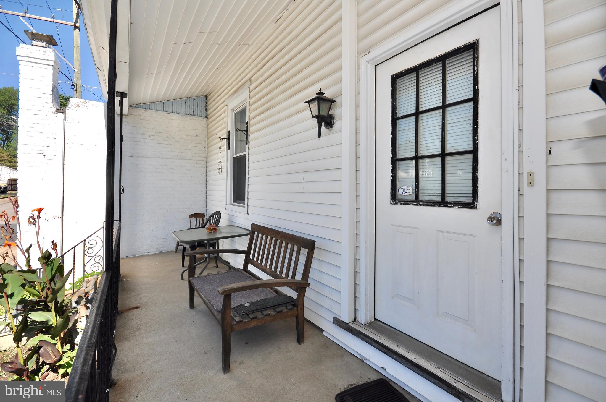 a view of a bench in the porch