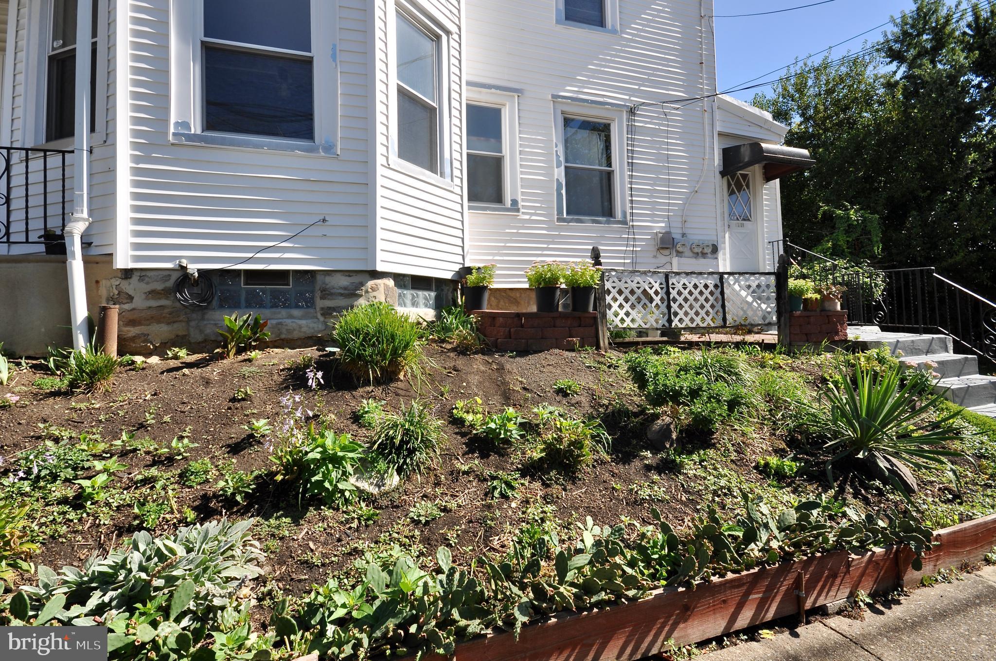 223 Ryers Avenue Cheltenham, PA 19012 - Photo 19 of 25 a view of a house with a yard and sitting area