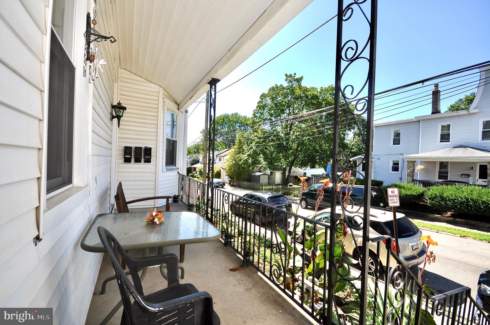 223 Ryers Avenue Cheltenham, PA 19012 - Photo 4 of 25 a view of a patio with chairs and table in a patio