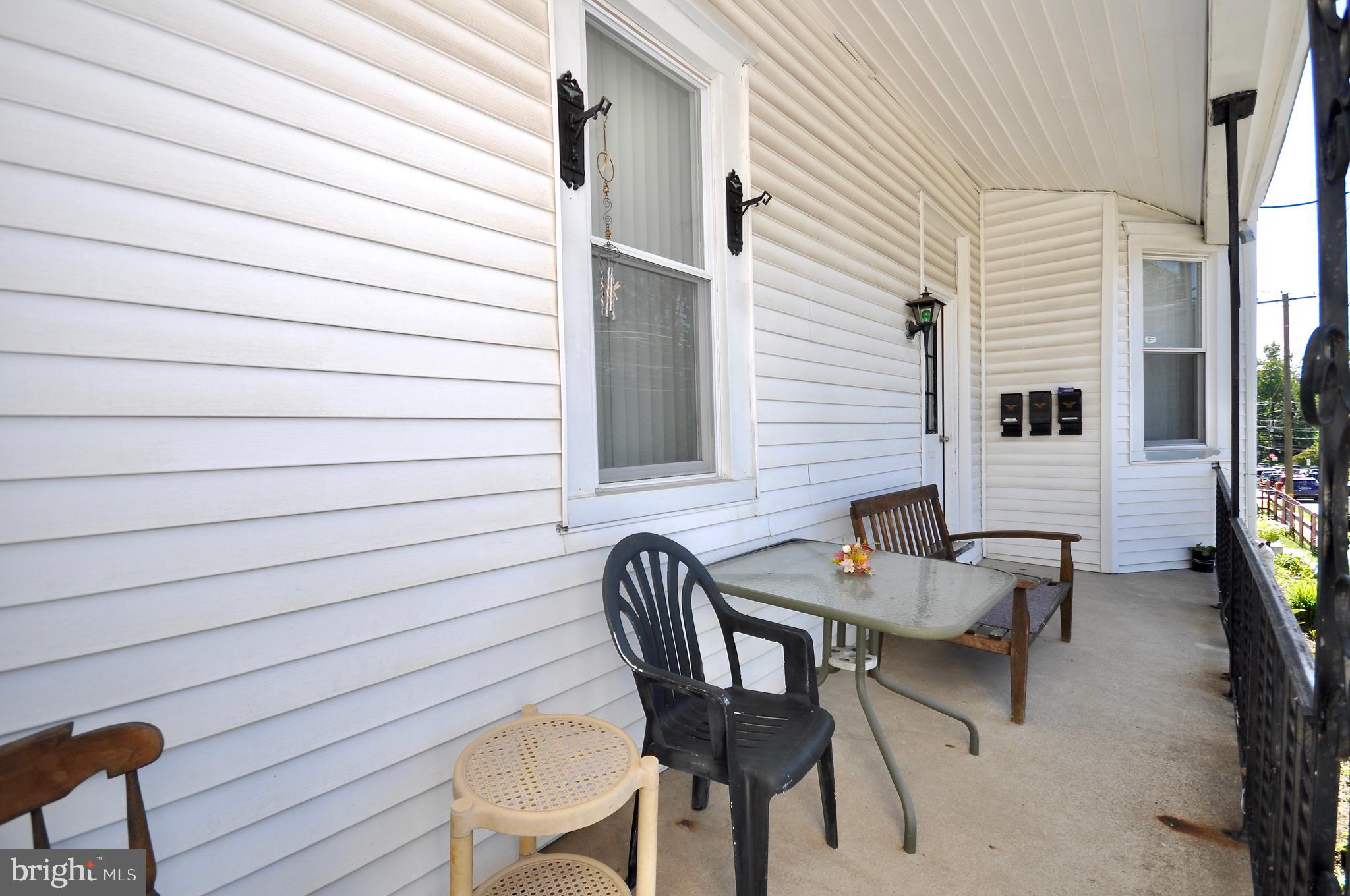 223 Ryers Avenue Cheltenham, PA 19012 - Photo 5 of 25 a balcony with table and chairs and a barbeque