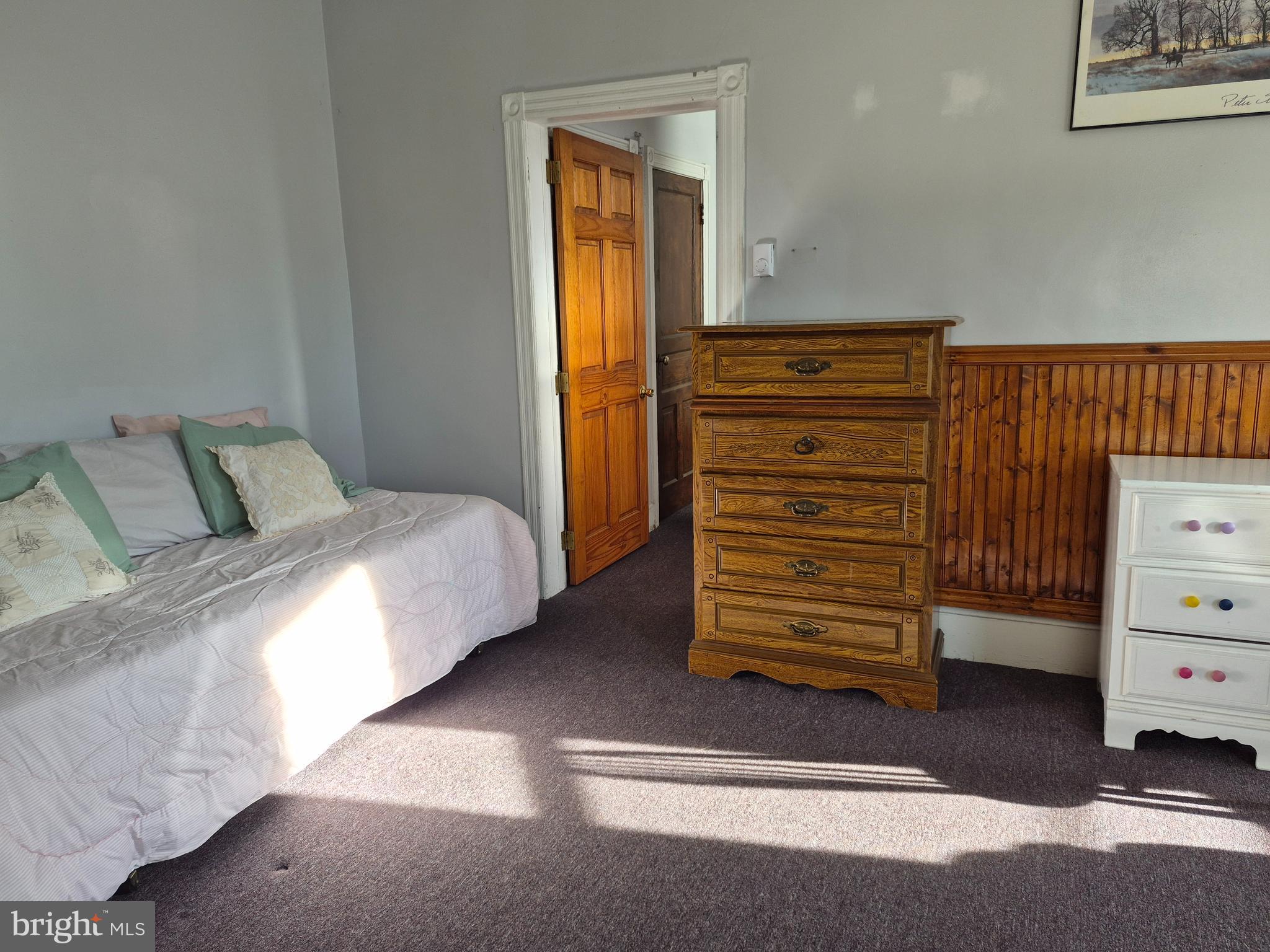 223 Ryers Avenue Cheltenham, PA 19012 - Photo 9 of 25 a bedroom with a bed and a dresser