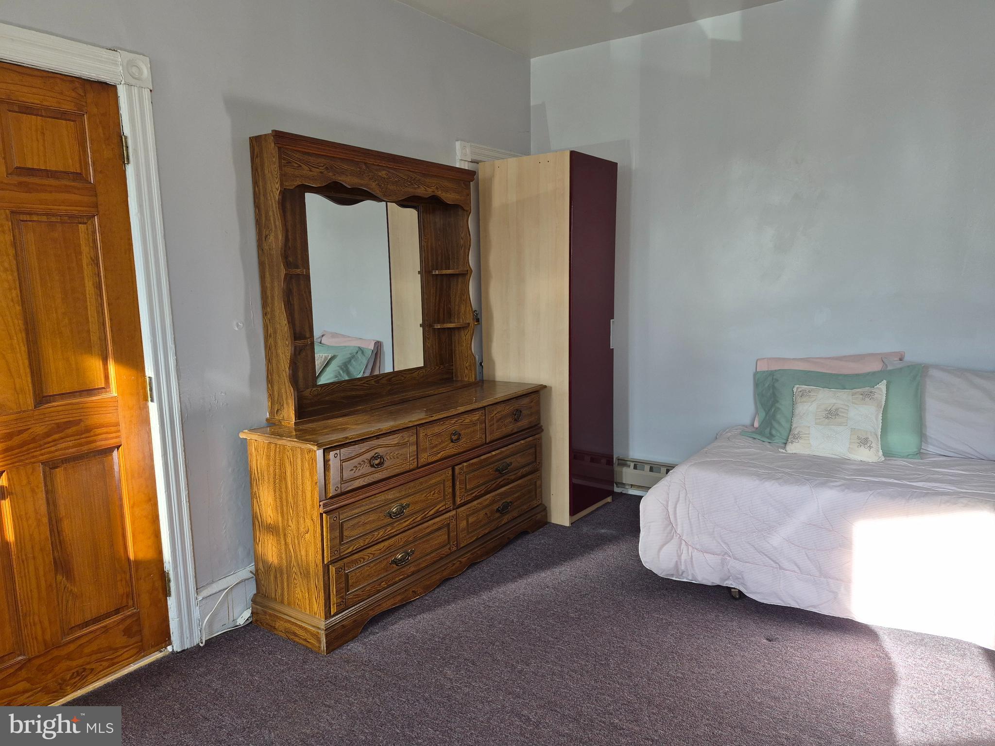 223 Ryers Avenue Cheltenham, PA 19012 - Photo 10 of 25 a bedroom with a bed and a dresser