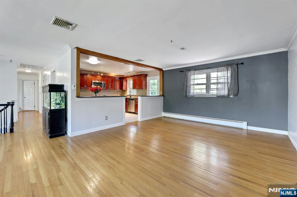 20 Blue Hill Road Norwood, NJ 07648 - Photo 9 of 49 a view of an empty room with window and wooden floor
