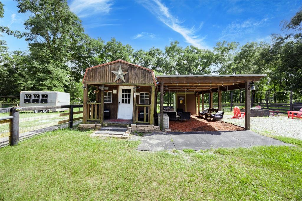 9106 Southwest 124 Street Archer, FL 32618 - Photo 12 of 57 a view of a house with backyard porch and sitting area