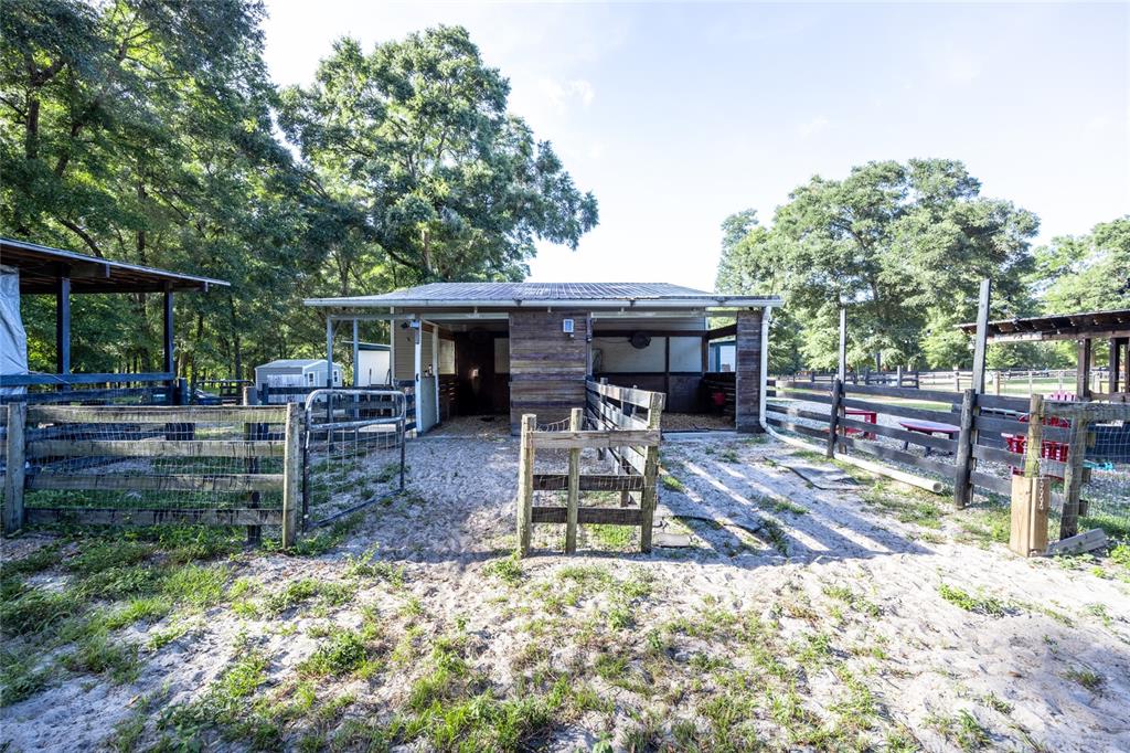 9106 Southwest 124 Street Archer, FL 32618 - Photo 18 of 57 a view of a house with backyard porch and sitting area
