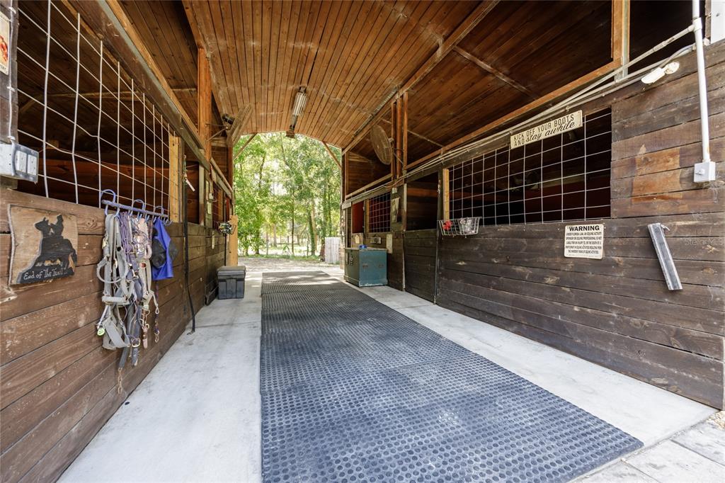 9106 Southwest 124 Street Archer, FL 32618 - Photo 6 of 57 a view of an empty room with wooden floor
