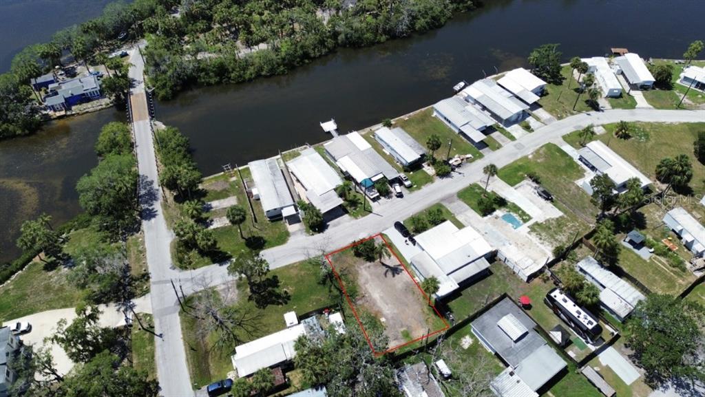 6828 Edgewater Drive New Port Richey, FL 34652 - Photo 7 of 7 an aerial view of a house with a lake view
