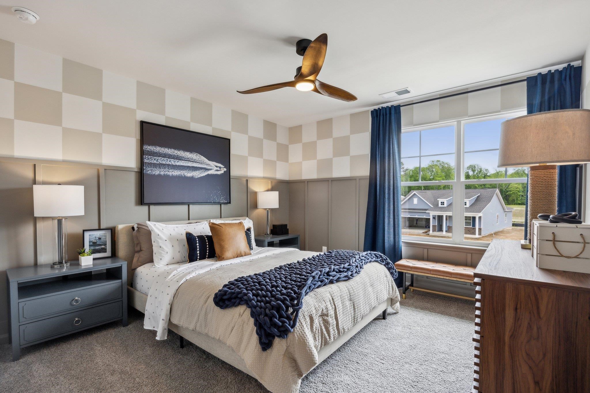 490 Rachel Drive Penn Laird, VA 22846 - Photo 25 of 30 a bedroom with a bed a chandelier and a flat screen tv