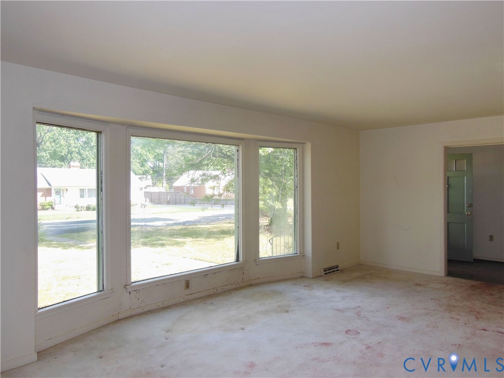 8218 Overbury Road Richmond, VA 23227 - Photo 6 of 37 a view of an empty room with a window