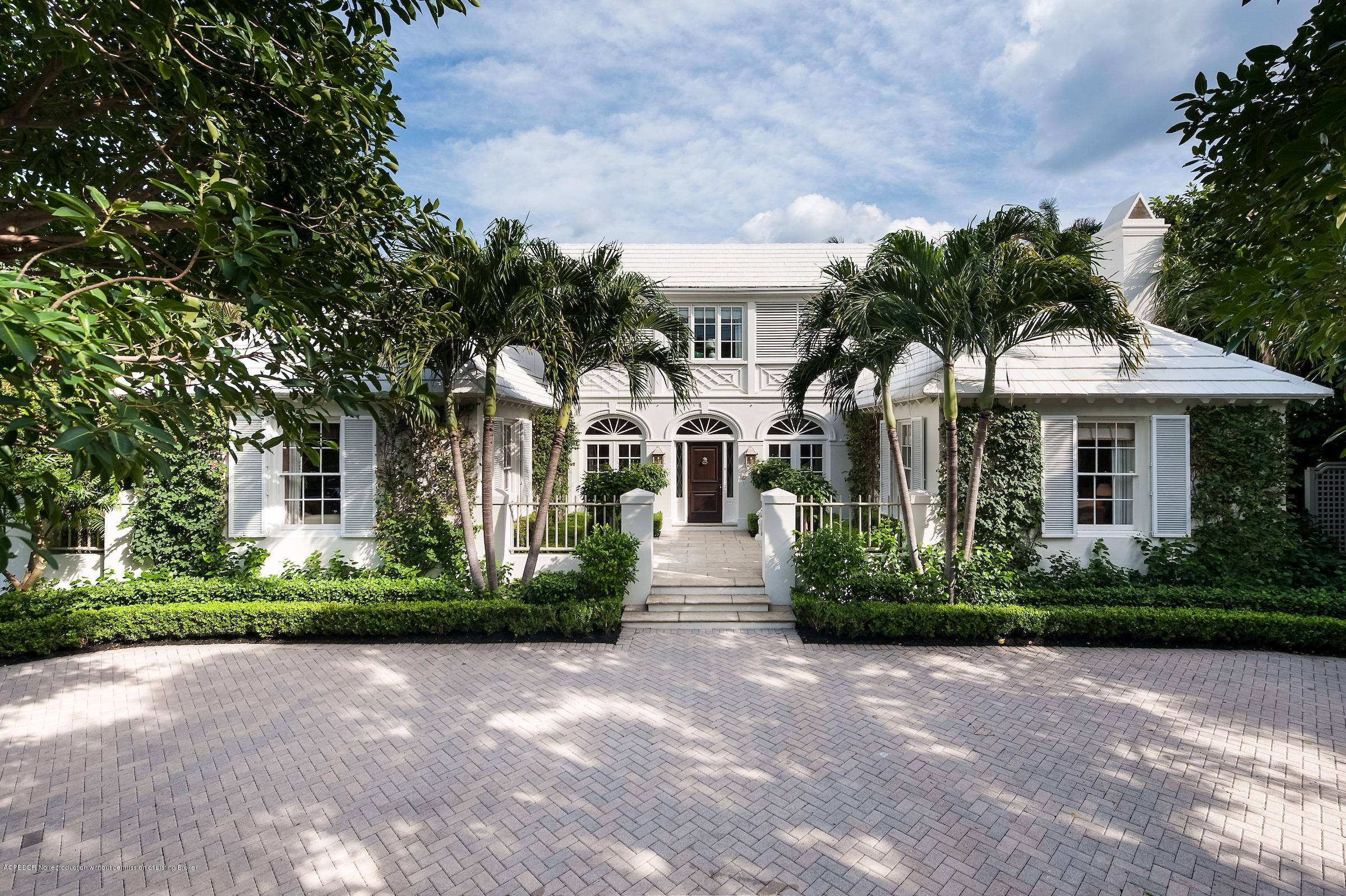 577 South County Road Palm Beach, FL 33480 - Photo 1 of 11 a front view of a house with a garden