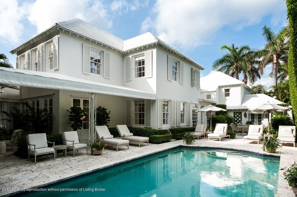 577 South County Road Palm Beach, FL 33480 - Photo 2 of 11 a front view of a house with swimming pool and furniture