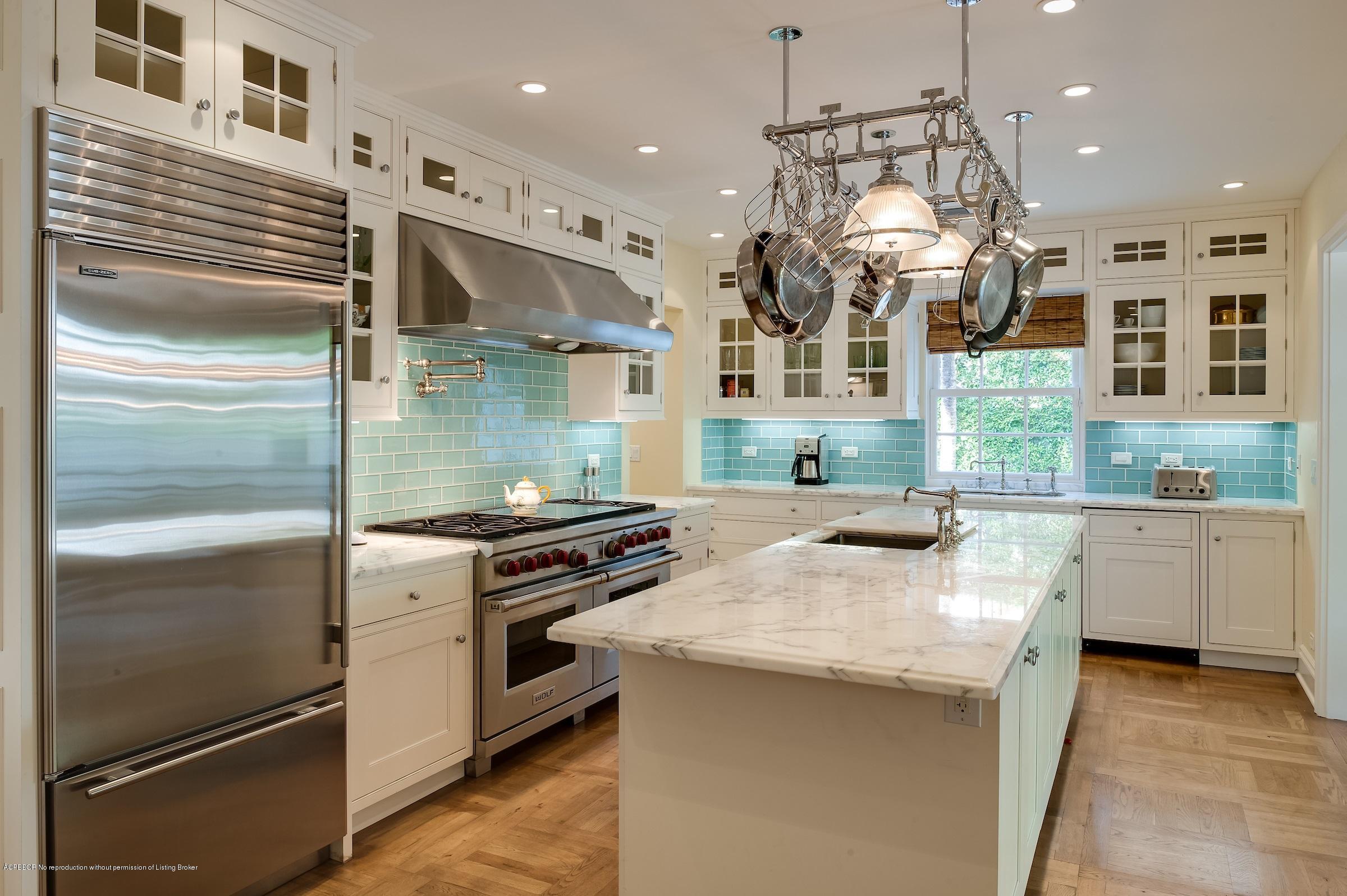 577 South County Road Palm Beach, FL 33480 - Photo 8 of 11 a kitchen with stainless steel appliances granite countertop a sink a stove and a refrigerator