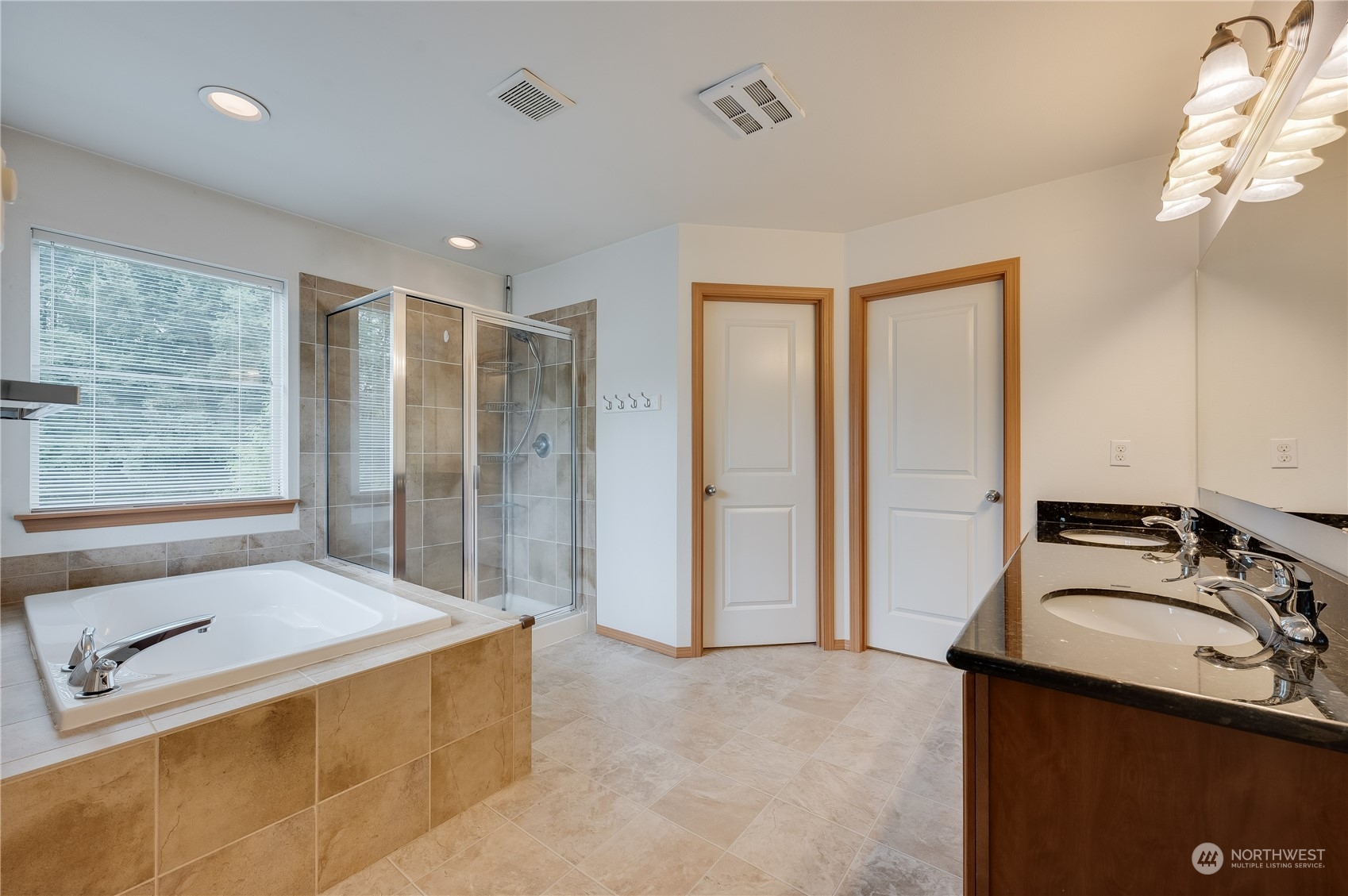 1321 173 Place Southeast Bothell, WA 98012 - Photo 17 of 25 a spacious bathroom with a tub sink and mirror