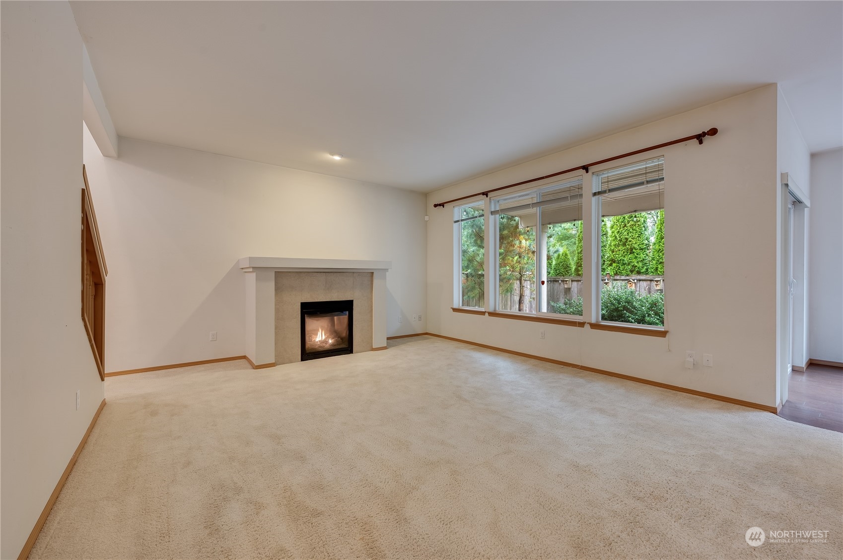 1321 173 Place Southeast Bothell, WA 98012 - Photo 3 of 25 a view of an empty room with a window and fireplace