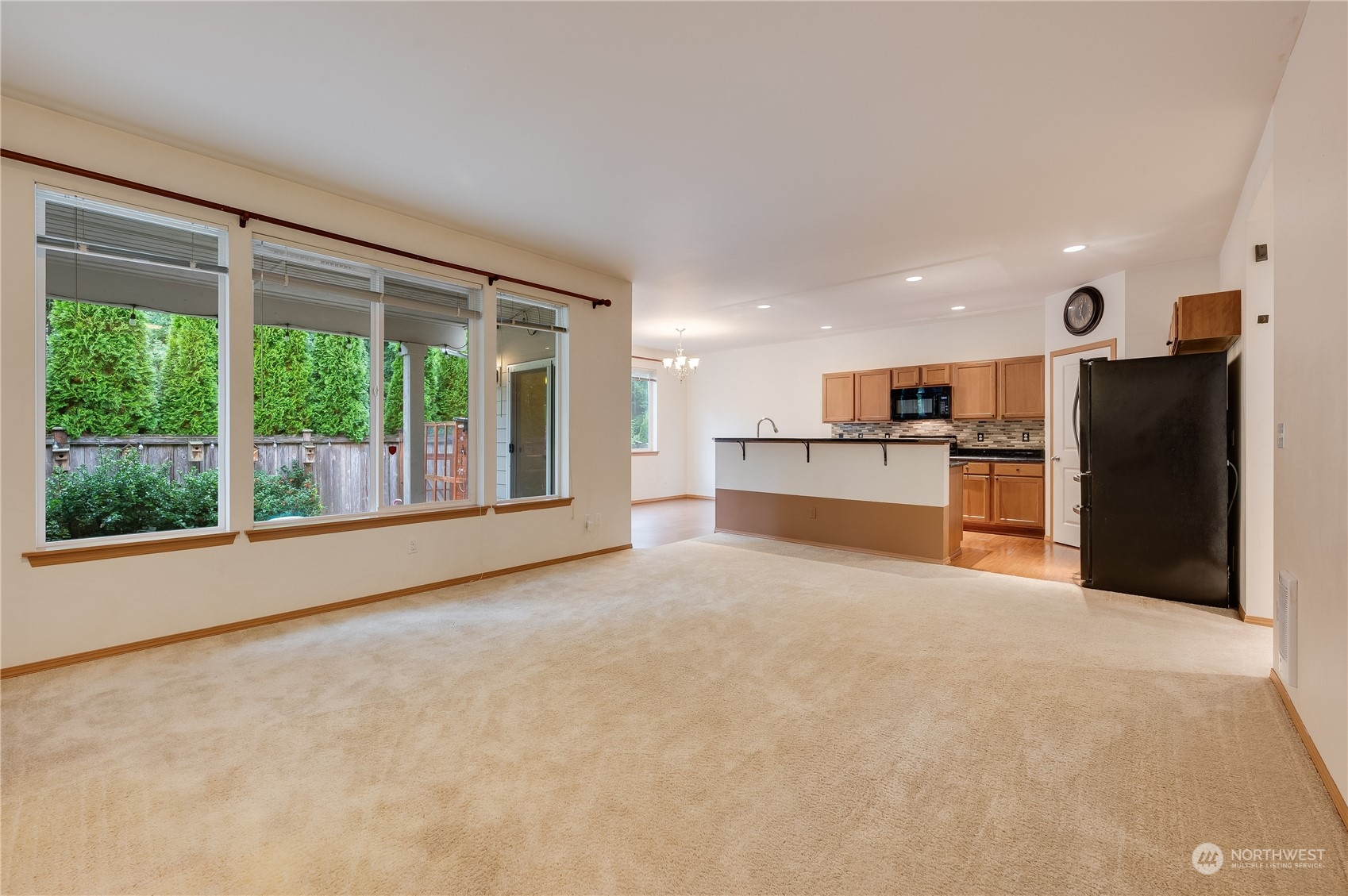 1321 173 Place Southeast Bothell, WA 98012 - Photo 4 of 25 a big room with yard and large windows