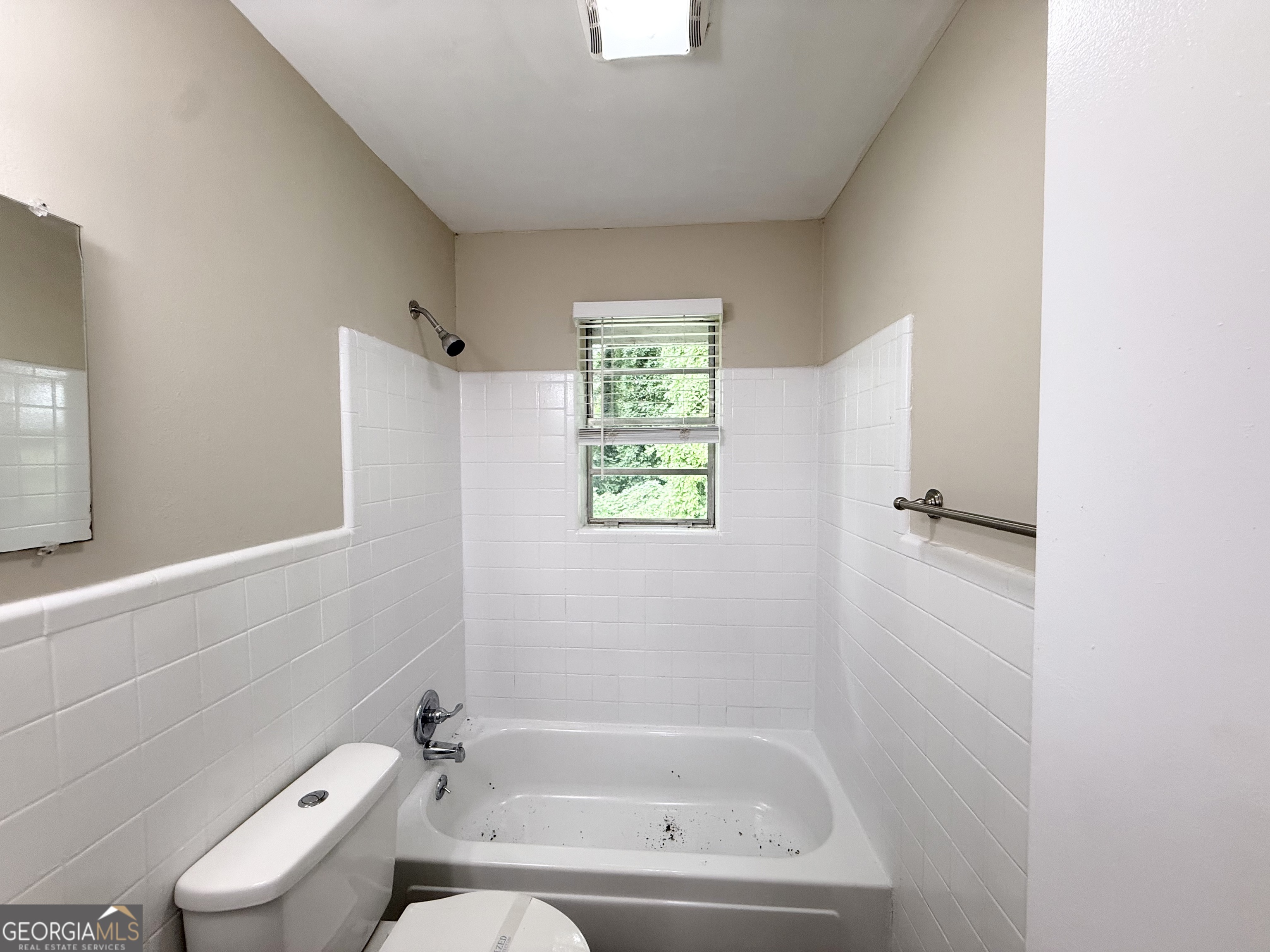 2782 Ocean Valley Road Atlanta, GA 30349 - Photo 16 of 27 a bathroom with a bathtub and toilet