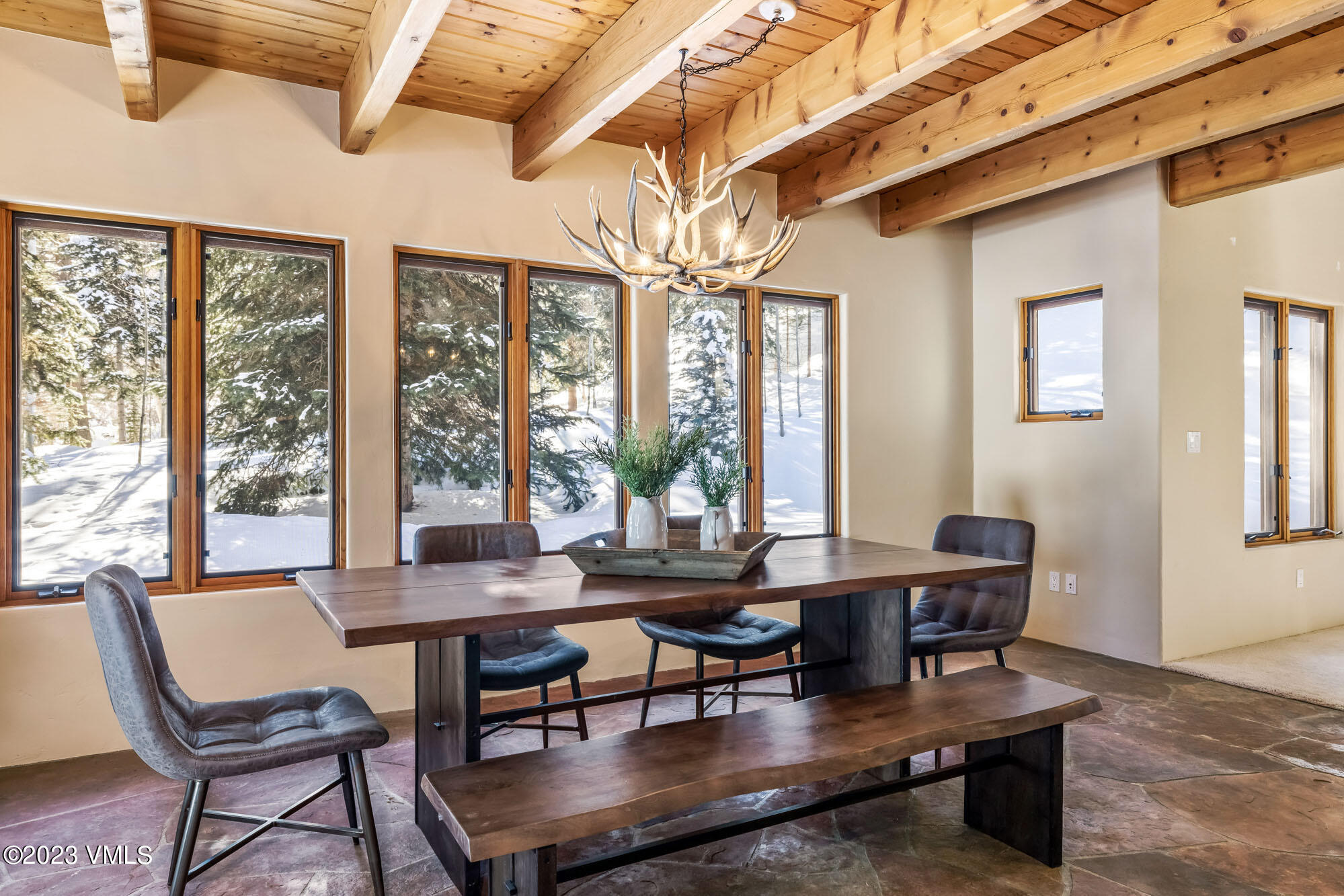 25 Casteel Creek Road Edwards, CO 81632 - Photo 17 of 87 a dining room with furniture a chandelier and wooden floor