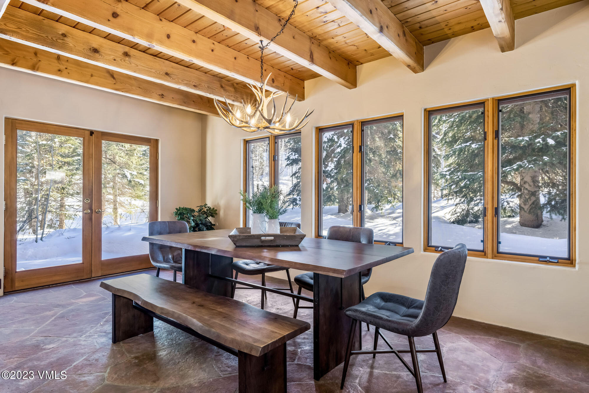 25 Casteel Creek Road Edwards, CO 81632 - Photo 18 of 87 a view of a dining room with furniture large windows and wooden floor