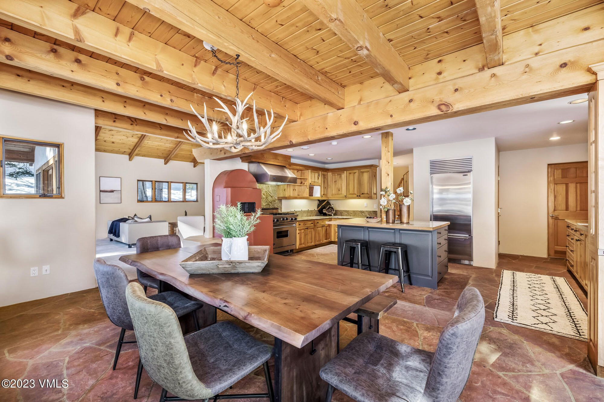 25 Casteel Creek Road Edwards, CO 81632 - Photo 19 of 87 a view of a dining room with furniture a chandelier and wooden floor