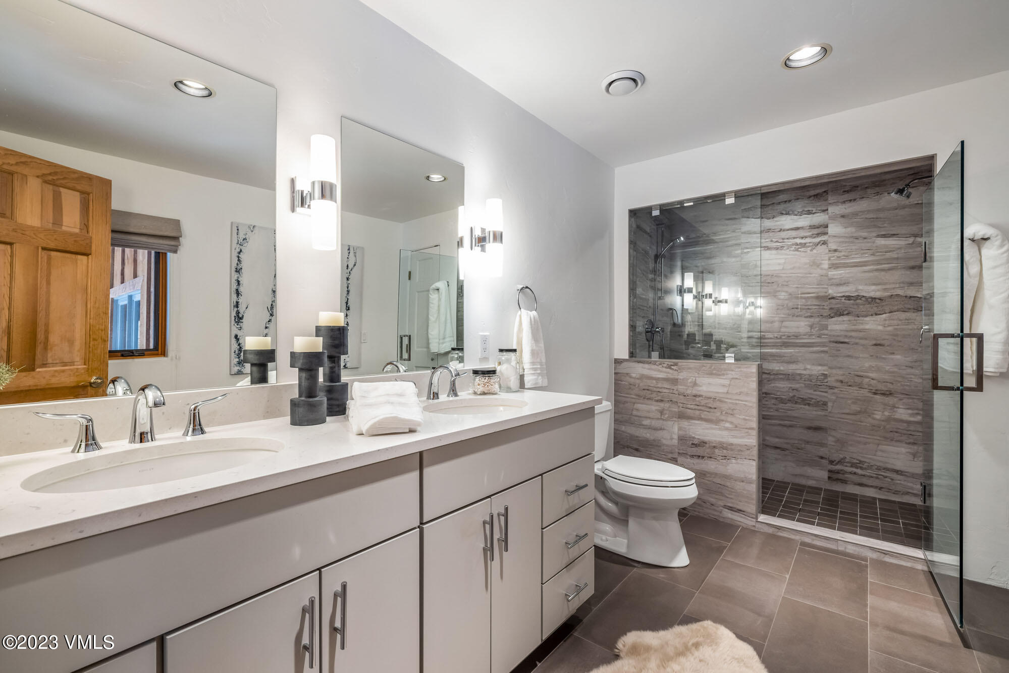 25 Casteel Creek Road Edwards, CO 81632 - Photo 24 of 87 a bathroom with a double vanity sink toilet and shower