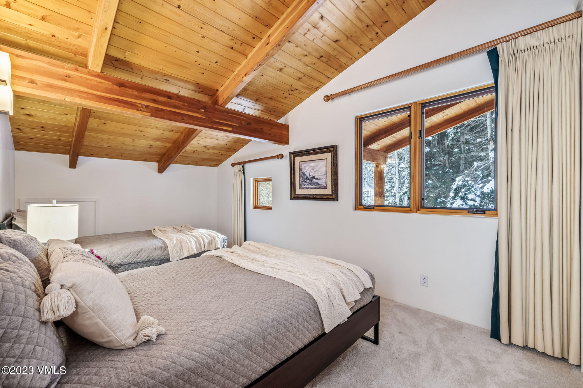 25 Casteel Creek Road Edwards, CO 81632 - Photo 32 of 87 a bedroom with a bed and a large window