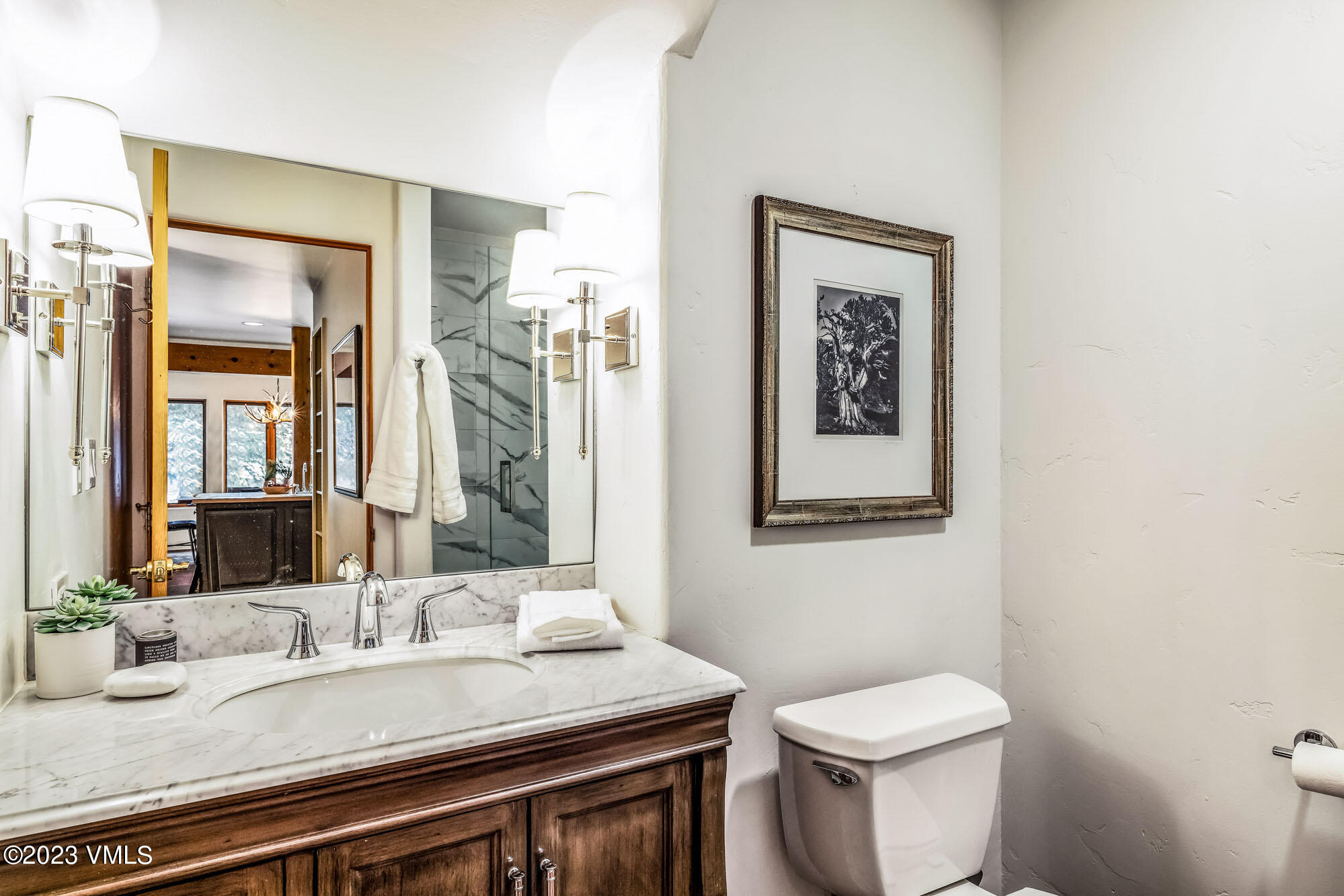 25 Casteel Creek Road Edwards, CO 81632 - Photo 34 of 87 a bathroom with a granite countertop toilet a sink and a mirror