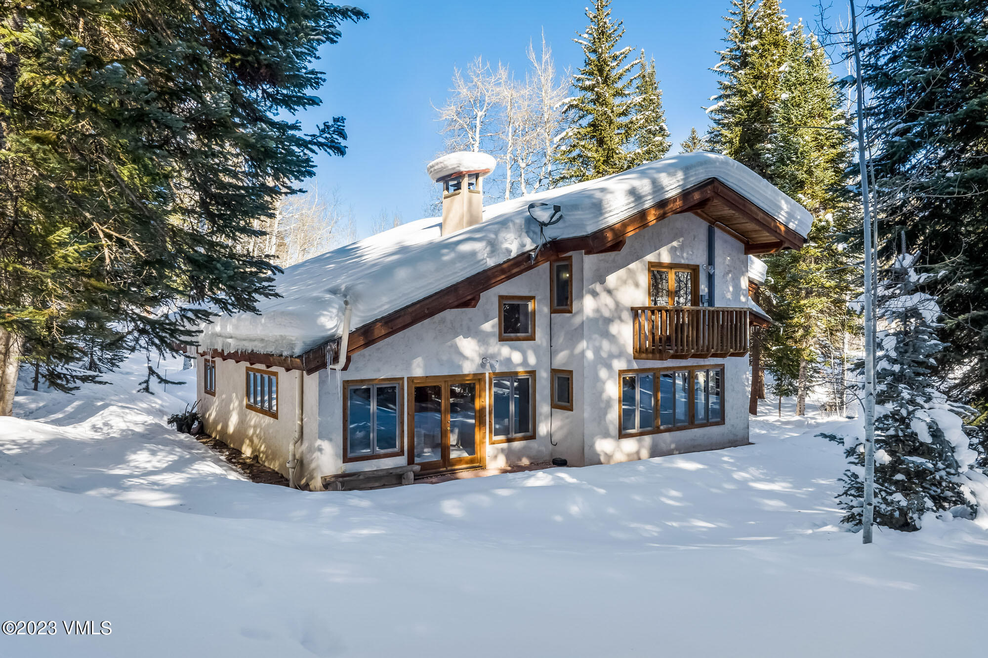 25 Casteel Creek Road Edwards, CO 81632 - Photo 38 of 87 a view of a big house with large trees and plants
