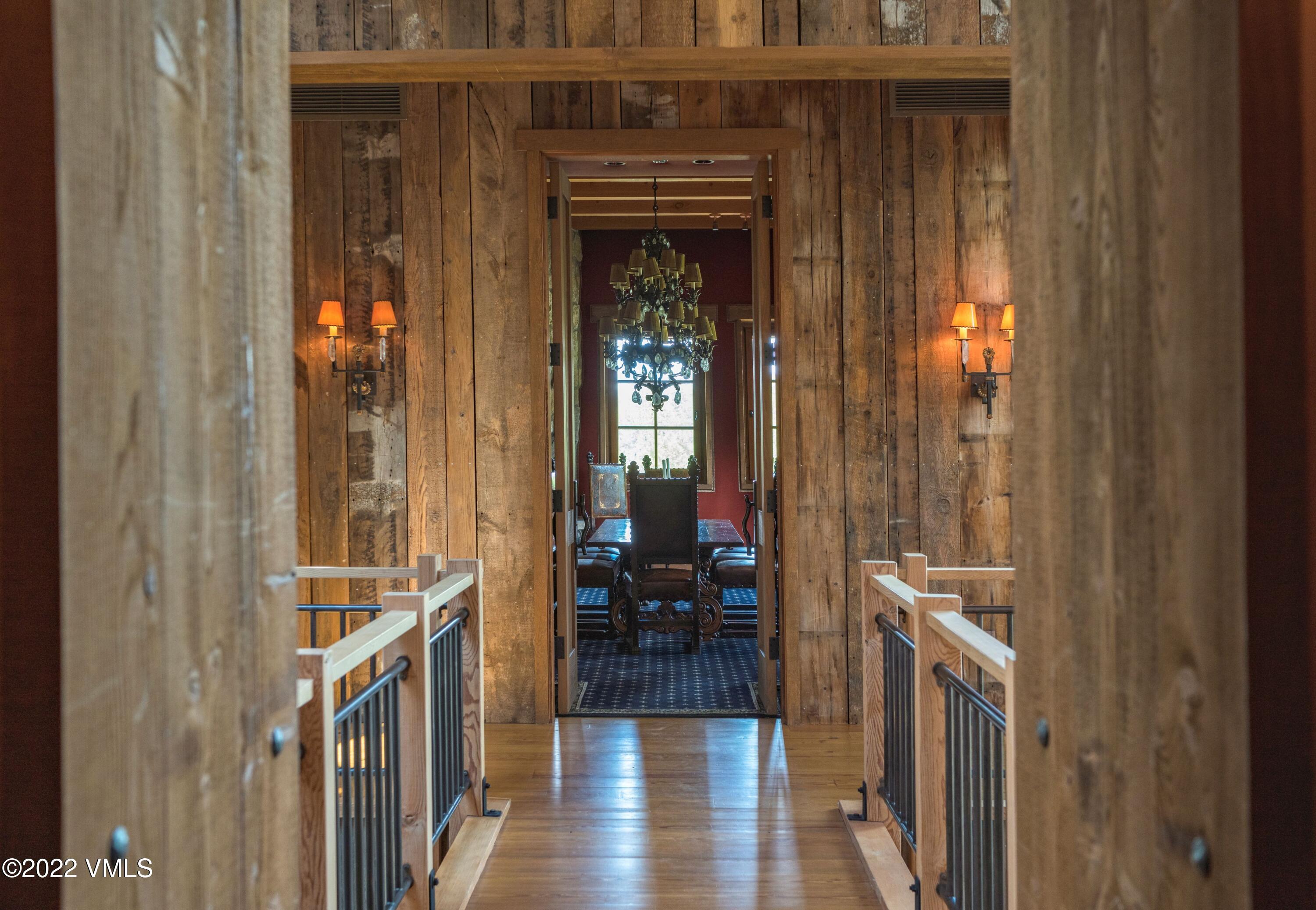 25 Casteel Creek Road Edwards, CO 81632 - Photo 63 of 87 a view of a hallway with wooden floor and windows